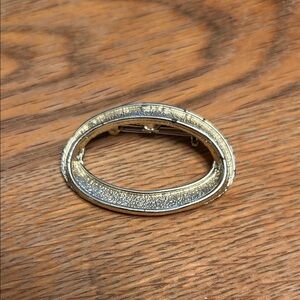 Chic Gold-Tone Oval Brooch With Pebbled Surface